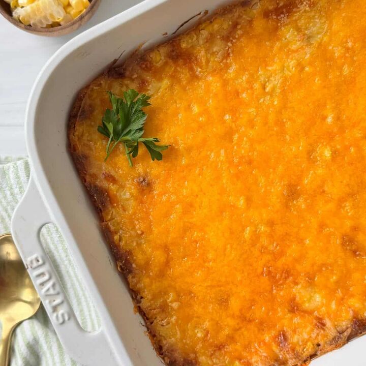 gluten free corn casserole, A gluten free corn casserole in a white dish with a spoon