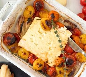 baked feta dip, Baked feta in a white casserole dish with tomatoes garlic shallots and thyme