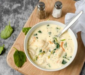 chicken gnocchi soup recipe comforting and hearty soup, Overhead image of a bowl of chicken gnocchi soup on a wooden cutting board