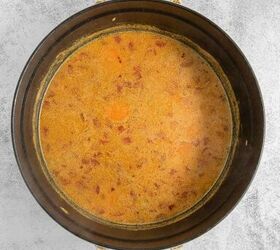 coconut curry soup, A simmering black pot of coconut curry soup