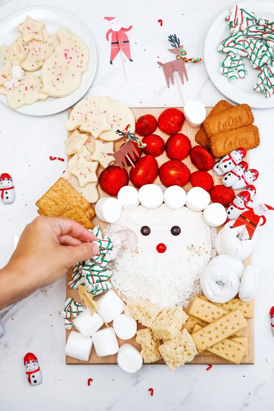 cinnamon crunch banana bread, santa buttercream frosting board dipping cookie in