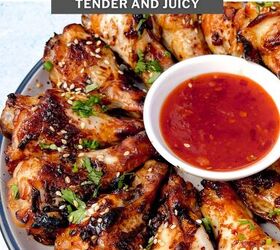 easy soy garlic chicken wings recipe, A plate of soy garlic chicken wings exquisitely baked and garnished with fresh herbs sits beside a bowl of red dipping sauce The text reads soy garlic chicken wings tender and juicy with a website URL subtly placed at the bottom
