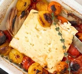 spinach and crab dip, Baked feta in a white casserole dish with tomatoes garlic and shallots