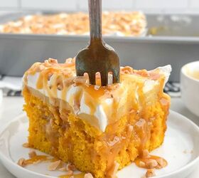 pumpkin poke cake, fork piercing a piece of pumpkin poke cake on a white plate