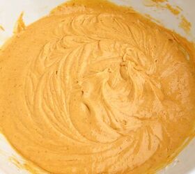 pumpkin poke cake, pumpkin cake batter in a white bowl