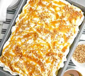 pumpkin poke cake, pumpkin poke cake topped with caramel sauce and toffee bits in a 9 x 13 pan