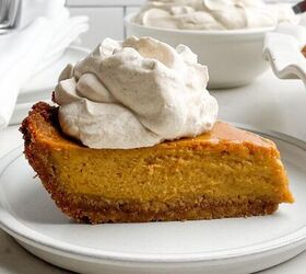 pumpkin poke cake, piece of pumpkin pie with graham cracker crust with a dollop of cinnamon brown sugar whipped cream