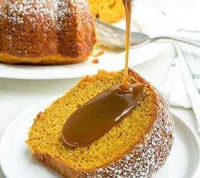 pumpkin poke cake, pumpkin cake with yellow cake mix on a white plate with caramel sauce being drizzled on top