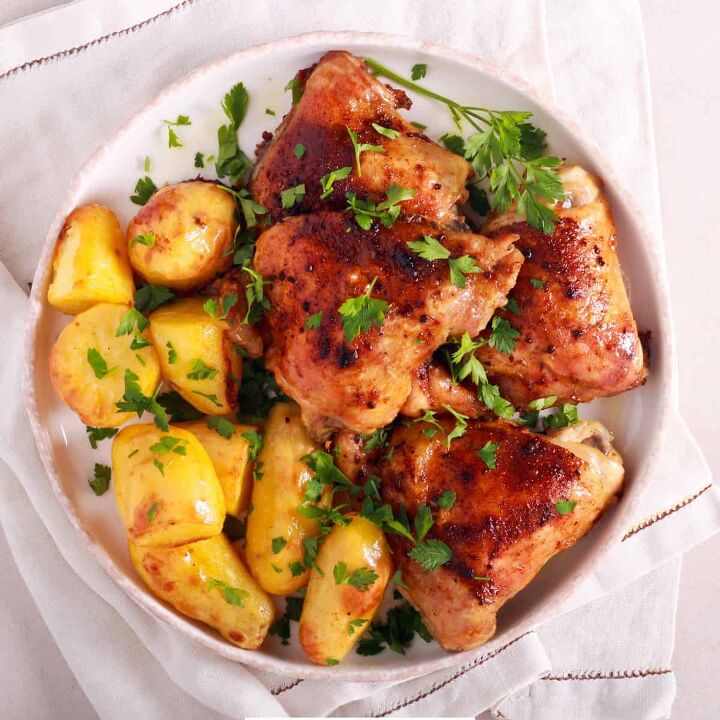 sheet pan chicken and potatoes easy sheet pan meal, Overhead image of roasted chicken and potatoes on a white plate