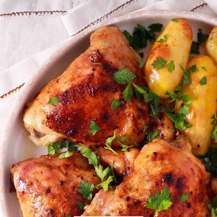 sheet pan chicken and potatoes easy sheet pan meal, Close up image of roasted chicken and potatoes on a white plate