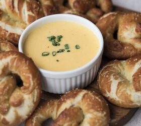 soft sourdough pretzels overnight recipe, The beer cheese is in focus in this picture surrounded by many sourdough pretzels