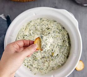 slow cooker spinach and artichoke dip, Slow Cooker Spinach and Artichoke Dip Scooped onto a Cracker in Crock Pot