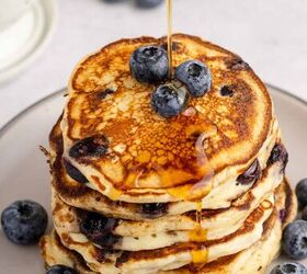 blueberry buttermilk pancakes, Blueberry Buttermilk Pancakes Stacked on a Plate With Maple Syrup