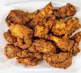 how to make buttermilk fried chicken, A plate filled with crispy golden brown fried chicken pieces resting on a paper towel