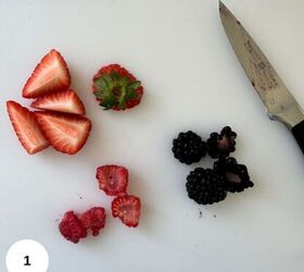 greek yogurt bark, Cutting the berries on a cutting board