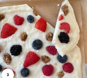 greek yogurt bark, Breaking the yogurt bark into pieces on the parchment paper