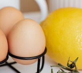 lemony green goddess chicken rice soup avgolemono style, Metal stand with eggs among colorful vegetables and lemon placed on white table against green asparagus and spaghetti in white cups