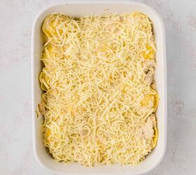 chicken alfredo baked ravioli, ravioli with chicken and alfredo topped with shredded cheese