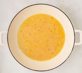 parmesan lemon chicken, sauce ingredients in a white skillet