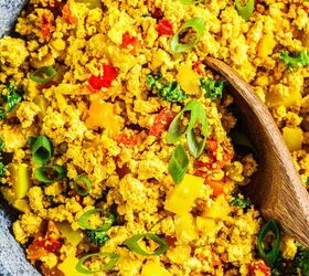 tofu scramble recipe the best vegan tofu scramble, Close up image of tofu scramble in a pan with a wooden serving spoon