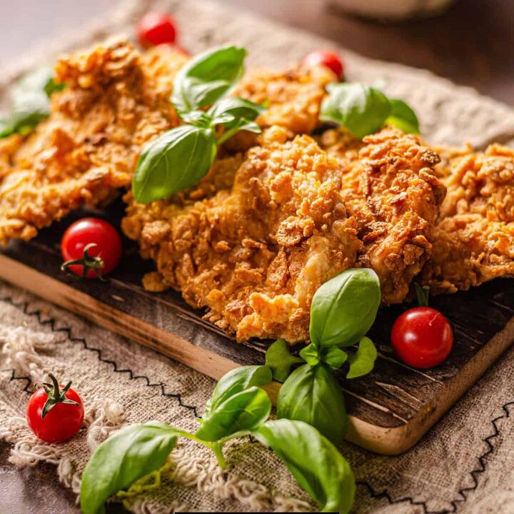 cornflake chicken recipe crunchy baked cornflake chicken, Conflake chicken on a pan with fresh herbs