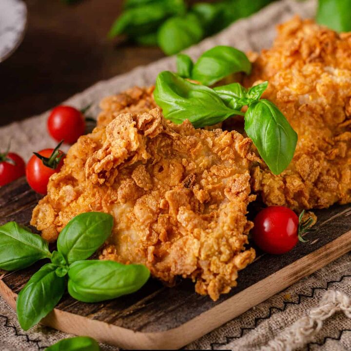 cornflake chicken recipe crunchy baked cornflake chicken, Close up image of cornflake chicken on a sheet pan