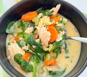 greek chicken soup with lemon and orzo gf, Spooning a bit of the soup out of the black bowl