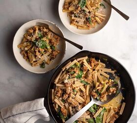 sausage pine nut currant pasta, Skillet of Sausage Pine Nut Currant Pasta and 2 servings in pottery bowls