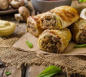 sausage rolls homemade sausage roll recipe, sausage rolls on a rustic surface with dipping sauces