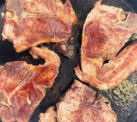 pan seared lamb loin chops with garlic sauce, Lamb chops being seared in a cast iron skillet
