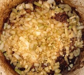 lamb stew dutch oven, Saut ing onion and garlic in a Dutch oven