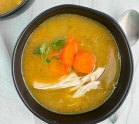 grandma s chicken soup, An overhead shot of Grandma s chicken soup with a spoon at the side