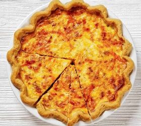 bacon quiche recipe easy bacon and cheddar quiche, Bacon Quiche in a white pie dish cut into slices