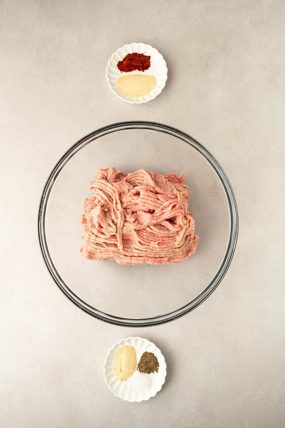 instant pot turkey burgers, ground turkey in a glass bowl with seasonings in small dishes