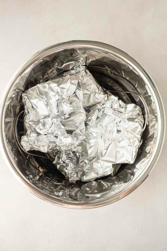 instant pot turkey burgers, burgers wrapped in foil and placed in the pressure cooker