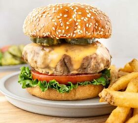 instant pot turkey burgers, turkey burger on a bun with lettuce tomato cheese and fries on the side