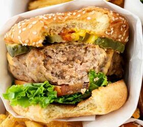 instant pot turkey burgers, turkey burger with a bite taken out in a casserole dish with fries