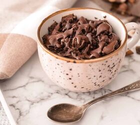 coffee mug cake recipe easy microwave coffee mug cake, A coffee mug cake on a marble counter top with a spoon next to it