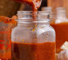 gluten free red enchilada sauce, Gluten Free Red Enchilada Sauce being poured into jars