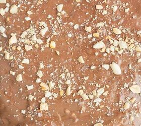 crunchy quinoa chocolate date bark a healthy ish sweet treat, step 8 to make the Crunchy Quinoa Chocolate Date Bark Recipe add melted chocolate on top of the peanut butter and top with more crushed peanuts