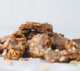 crunchy quinoa chocolate date bark a healthy ish sweet treat, chocolate date bark pieces piled on top of each other