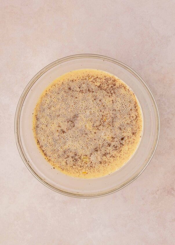 cherry cheesecake french toast casserole, egg mixture whisked in a glass bowl