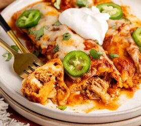 cheesy chicken enchiladas, Cheesy Chicken Enchiladas on a plate with jalape os and sour cream