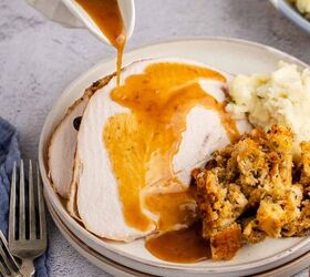 herb butter turkey and gravy, Herb Butter Turkey Sliced With Gravy On Top Being Poured