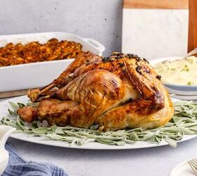 herb butter turkey and gravy, Herb Butter Turkey Cooked On a Platter with Fresh Sage