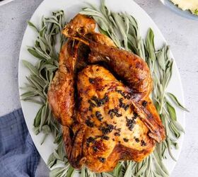 herb butter turkey and gravy, Herb Butter Turkey Cooked On a Platter with Fresh Sage