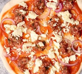 lamb sausage pizza with merguez, Toppings added to the pizza before baking