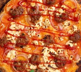 lamb sausage pizza with merguez, Sauce being added after the pizza has been baked