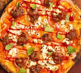 lamb sausage pizza with merguez, Fresh mint being added to the pizza
