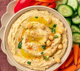 crispy chicken caesar salad, Delicious and smooth hummus without garlic artfully styled on a bowl with vibrant veggies and perfect for dipping